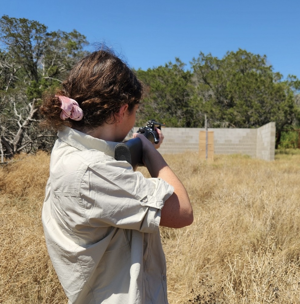 Sage performing darting practice using a modified rifle 